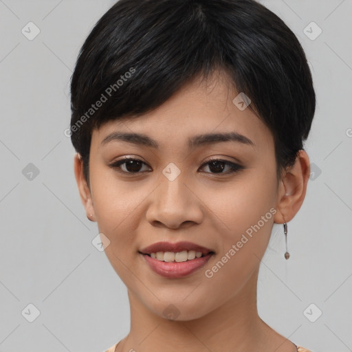 Joyful asian young-adult female with short  black hair and brown eyes