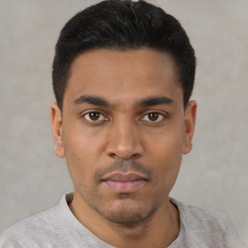 Neutral latino young-adult male with short  black hair and brown eyes
