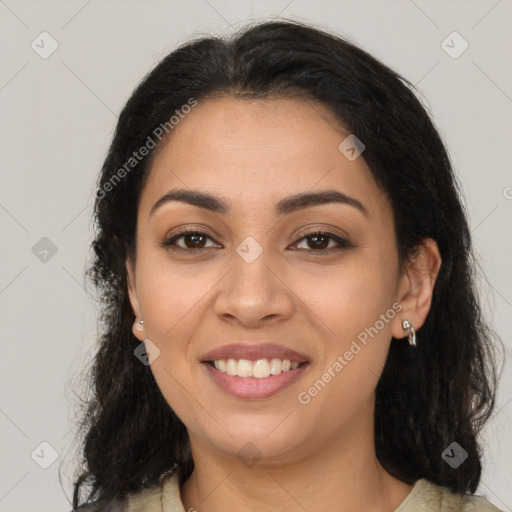 Joyful latino young-adult female with long  brown hair and brown eyes