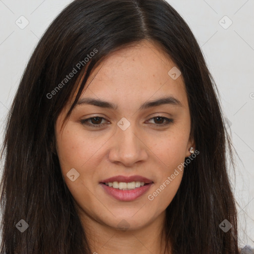 Joyful latino young-adult female with long  brown hair and brown eyes