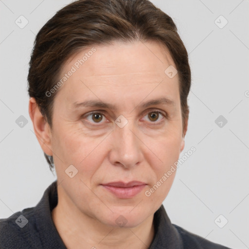 Joyful white adult female with short  brown hair and grey eyes