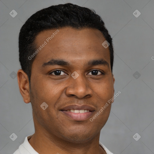 Joyful black young-adult male with short  brown hair and brown eyes