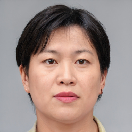 Neutral asian adult female with short  brown hair and brown eyes