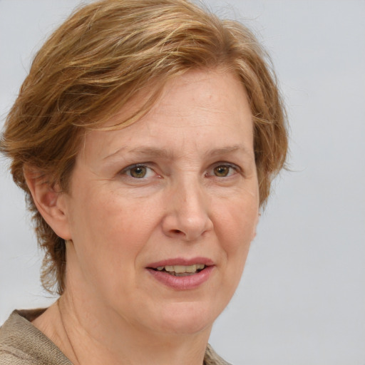 Joyful white adult female with medium  brown hair and blue eyes