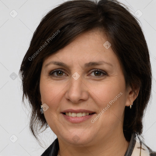 Joyful white adult female with medium  brown hair and brown eyes