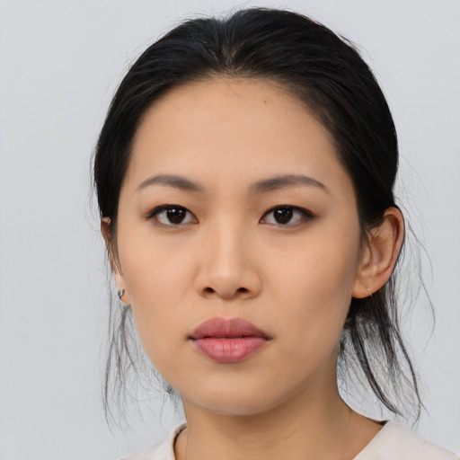 Neutral asian young-adult female with medium  black hair and brown eyes