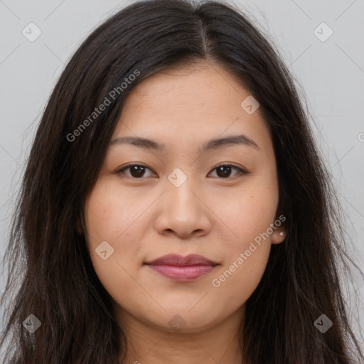 Joyful asian young-adult female with long  brown hair and brown eyes