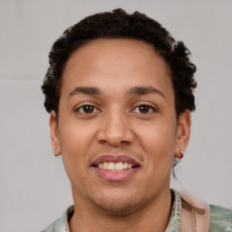 Joyful latino young-adult male with short  brown hair and brown eyes