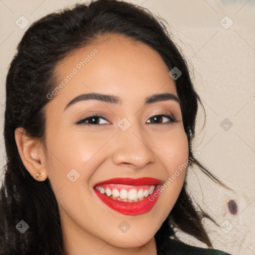 Joyful latino young-adult female with long  brown hair and brown eyes