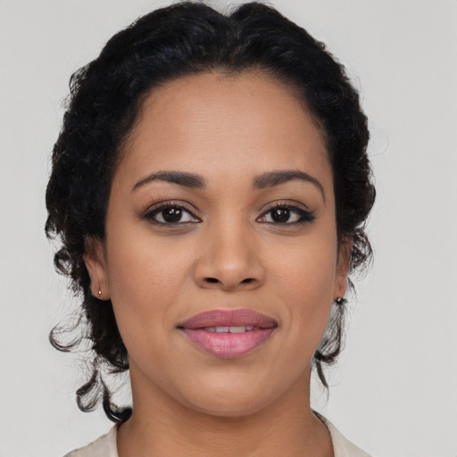 Joyful latino young-adult female with medium  black hair and brown eyes