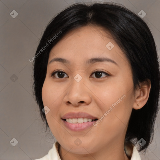 Joyful asian young-adult female with medium  brown hair and brown eyes