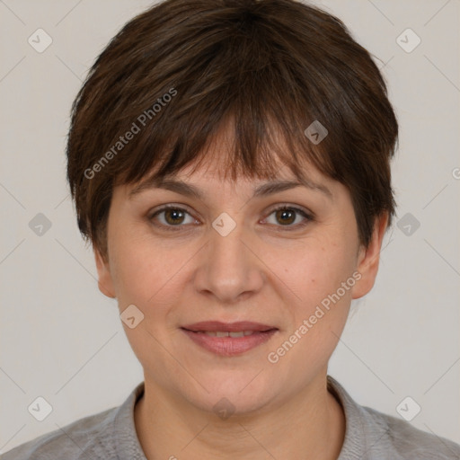 Joyful white adult female with short  brown hair and brown eyes