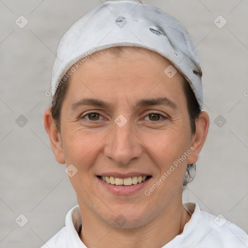 Joyful white adult female with short  brown hair and brown eyes