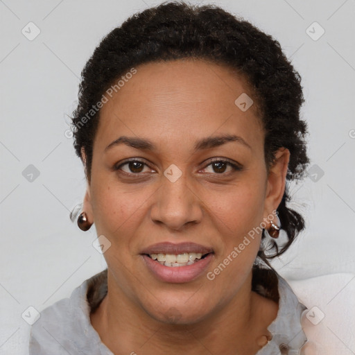 Joyful latino adult female with short  brown hair and brown eyes