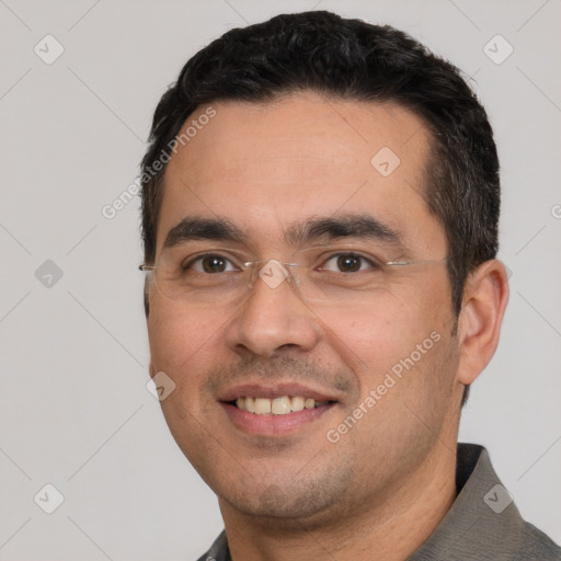 Joyful white young-adult male with short  black hair and brown eyes