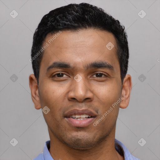 Joyful latino young-adult male with short  black hair and brown eyes