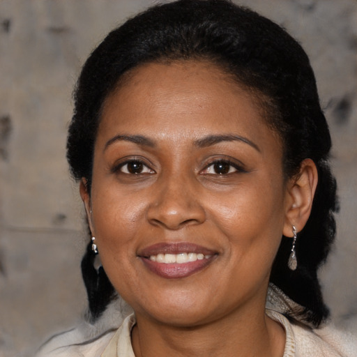 Joyful black young-adult female with medium  black hair and brown eyes