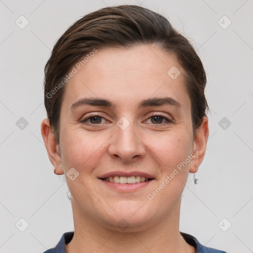 Joyful white young-adult female with short  brown hair and grey eyes