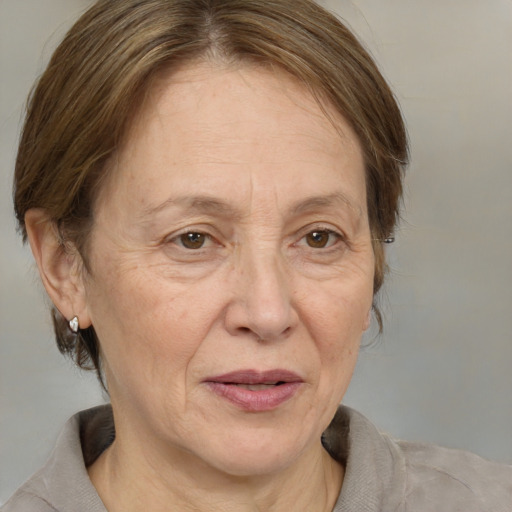 Joyful white middle-aged female with medium  brown hair and brown eyes