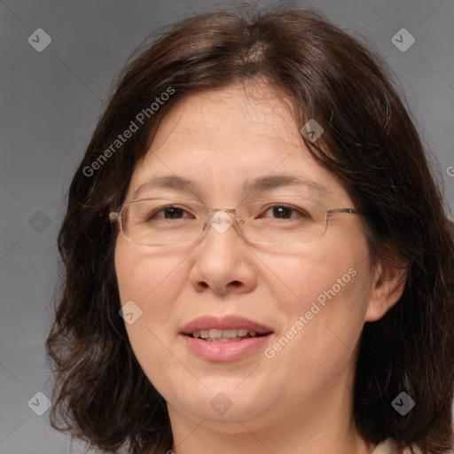 Joyful white adult female with medium  brown hair and brown eyes