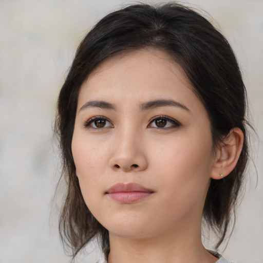 Neutral asian young-adult female with medium  brown hair and brown eyes