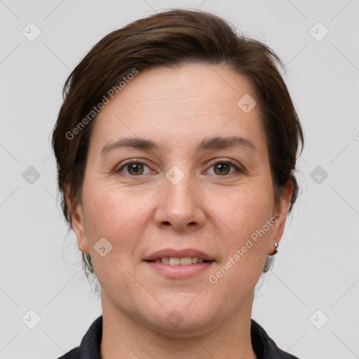 Joyful white adult female with medium  brown hair and grey eyes