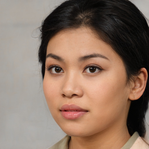 Neutral asian young-adult female with medium  brown hair and brown eyes
