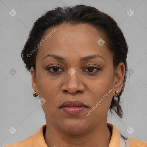 Joyful latino adult female with short  brown hair and brown eyes