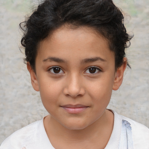 Joyful latino child female with short  brown hair and brown eyes