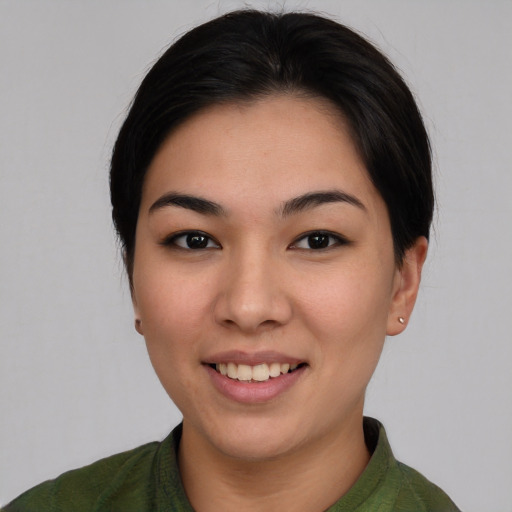 Joyful white young-adult female with medium  black hair and brown eyes