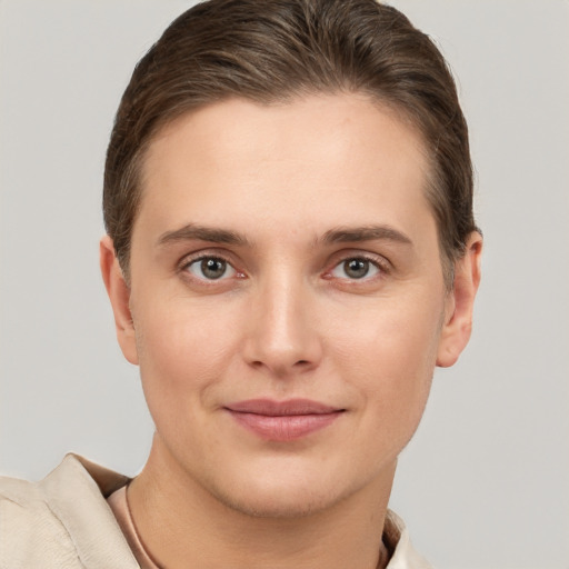 Joyful white young-adult female with short  brown hair and brown eyes