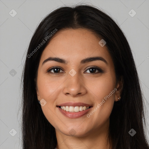 Joyful latino young-adult female with long  brown hair and brown eyes