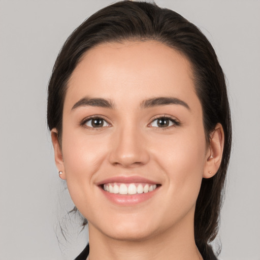 Joyful white young-adult female with medium  brown hair and brown eyes