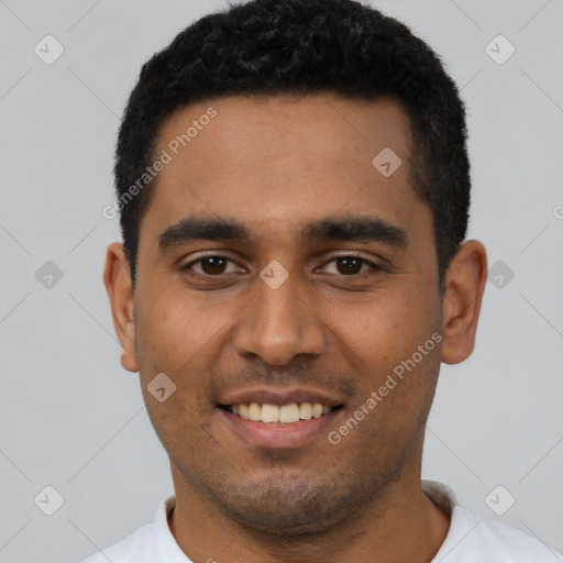 Joyful latino young-adult male with short  black hair and brown eyes