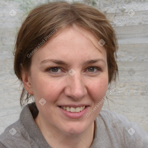 Joyful white adult female with medium  brown hair and grey eyes