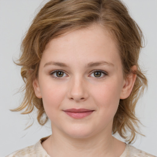 Joyful white child female with medium  brown hair and blue eyes