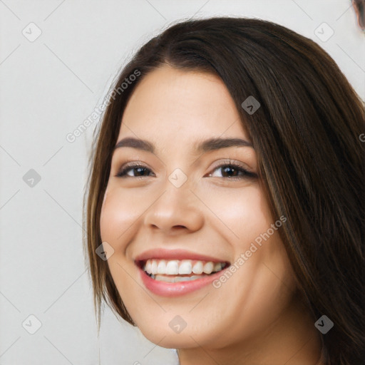 Joyful white young-adult female with long  brown hair and brown eyes