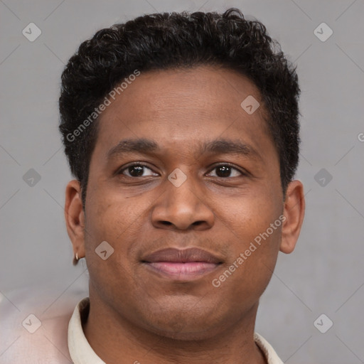 Joyful latino young-adult male with short  brown hair and brown eyes