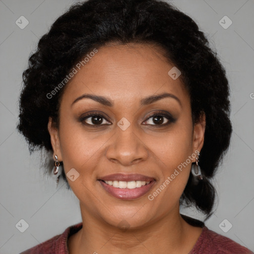 Joyful black adult female with medium  brown hair and brown eyes