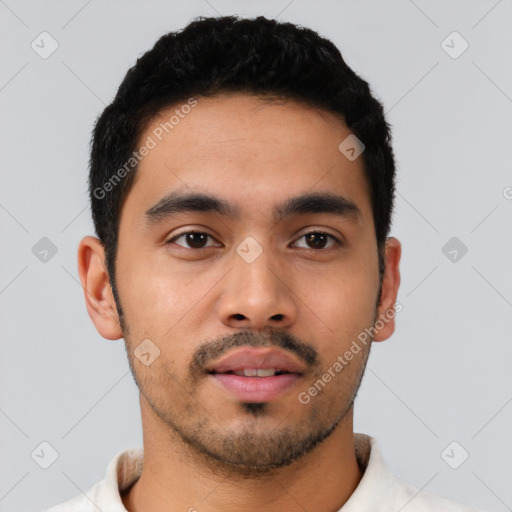 Neutral latino young-adult male with short  black hair and brown eyes