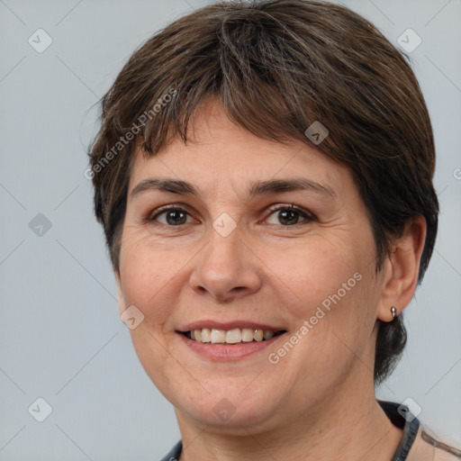 Joyful white adult female with medium  brown hair and brown eyes