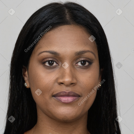 Joyful black young-adult female with long  black hair and brown eyes