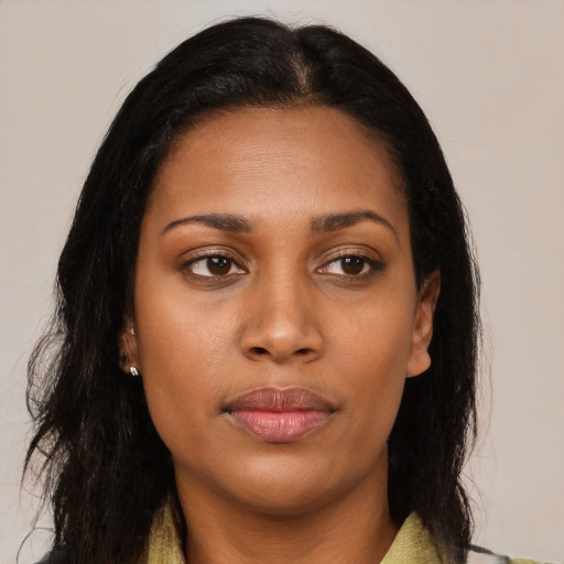 Neutral black young-adult female with long  brown hair and brown eyes