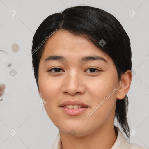 Joyful asian young-adult female with medium  black hair and brown eyes