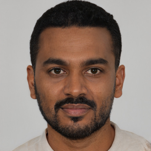 Neutral black young-adult male with short  black hair and brown eyes