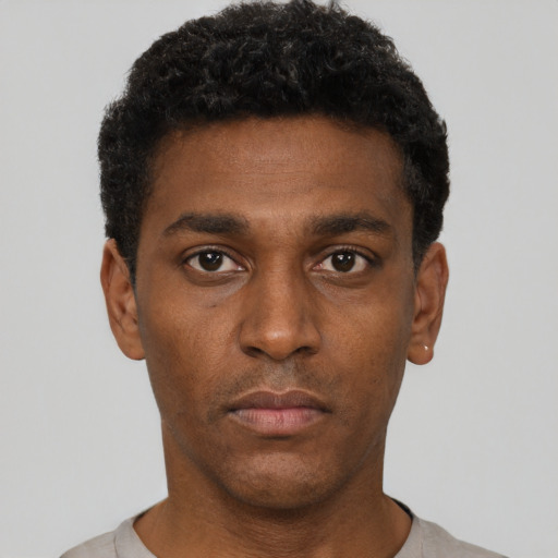 Neutral black young-adult male with short  black hair and brown eyes
