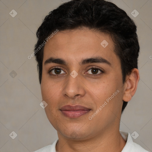 Joyful latino young-adult male with short  brown hair and brown eyes