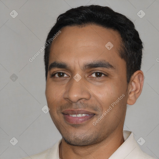 Joyful latino young-adult male with short  black hair and brown eyes