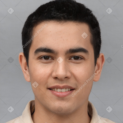 Joyful latino young-adult male with short  brown hair and brown eyes