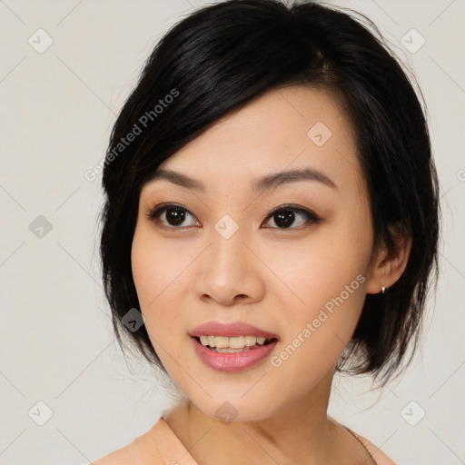 Joyful asian young-adult female with medium  black hair and brown eyes